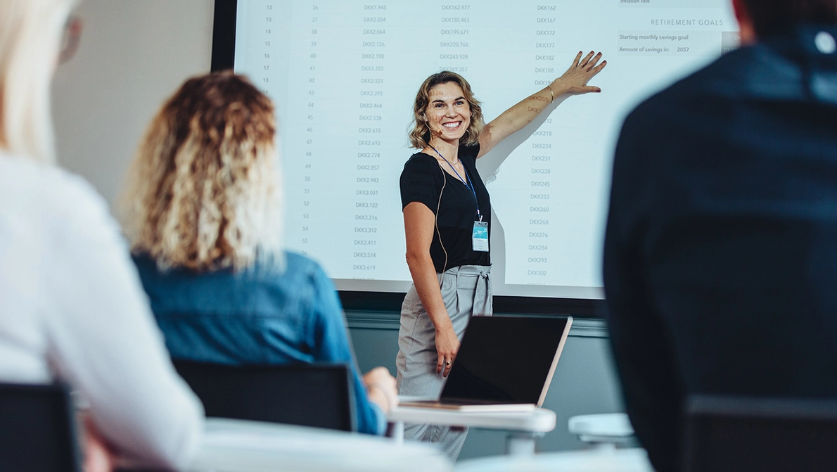 women in front of people holding a training session